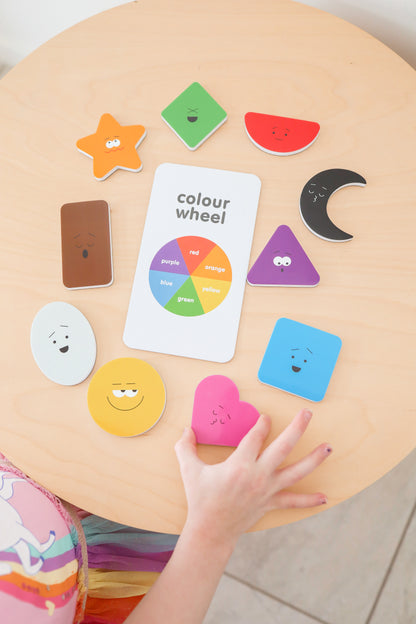 Colorful educational toys on a wooden surface with a child&